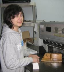 Alex working at AJ Printing as a Graphic Designer
