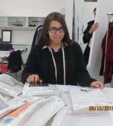 Victoria working at Eleventh Floor Apparel as a Fashion Designer